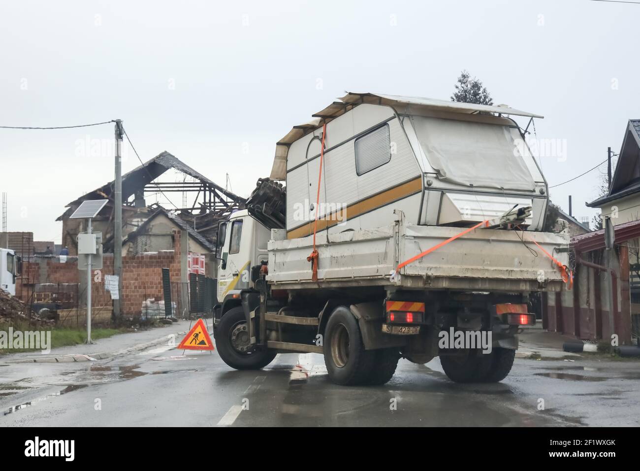 A catastrophic earthquake measuring 6.3 hit Petrinja and was felt in most of the country. 7 people died during earthquake.Trucks with camp trailer dri Stock Photo