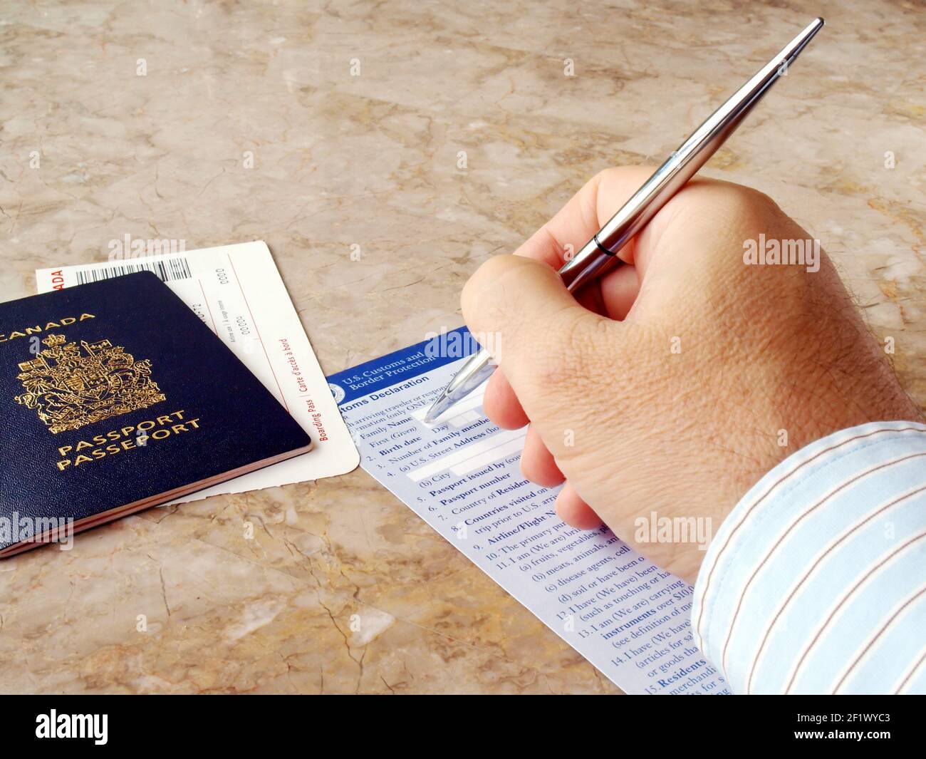 Man filling out form Stock Photo - Alamy