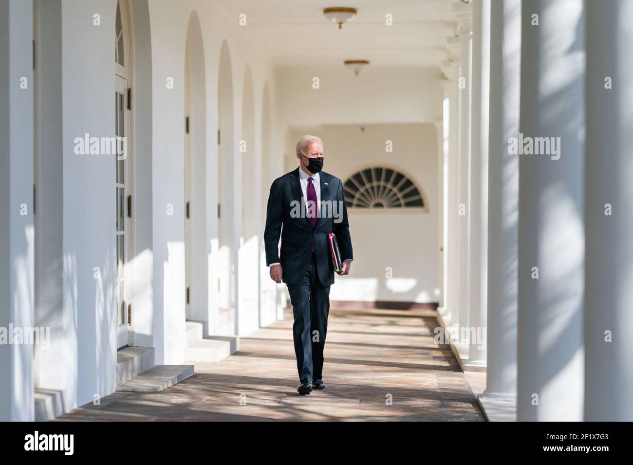 President Joe Biden walks along the Colonnade of the White House Tuesday, Feb. 23, 2021, to the Oval Office. Stock Photo