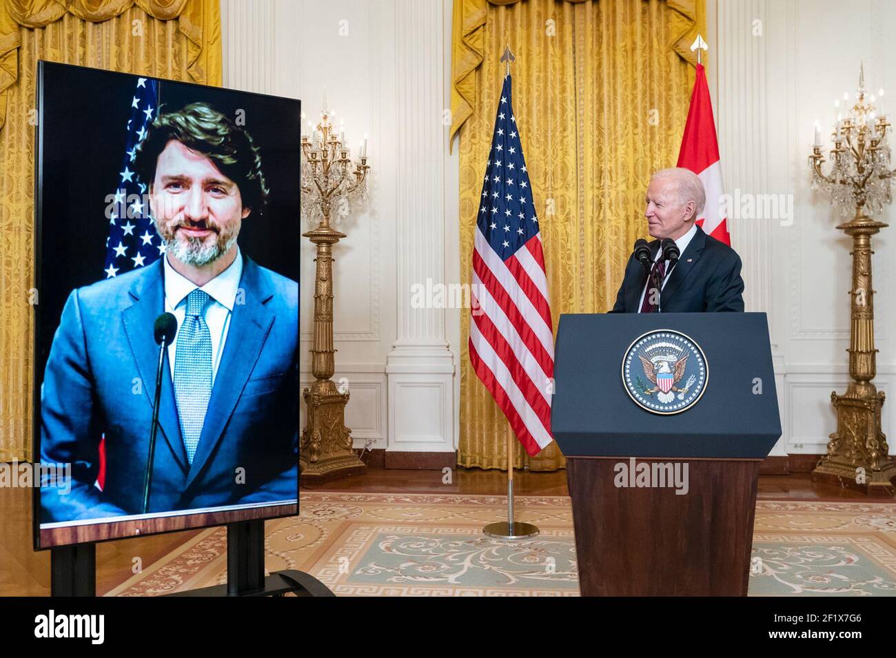 President Joe Biden delivers a virtual joint press statement with Canadian Prime Minister Justin Trudeau Tuesday, Feb. 23, 2021, in the East Room of the White House. Stock Photo