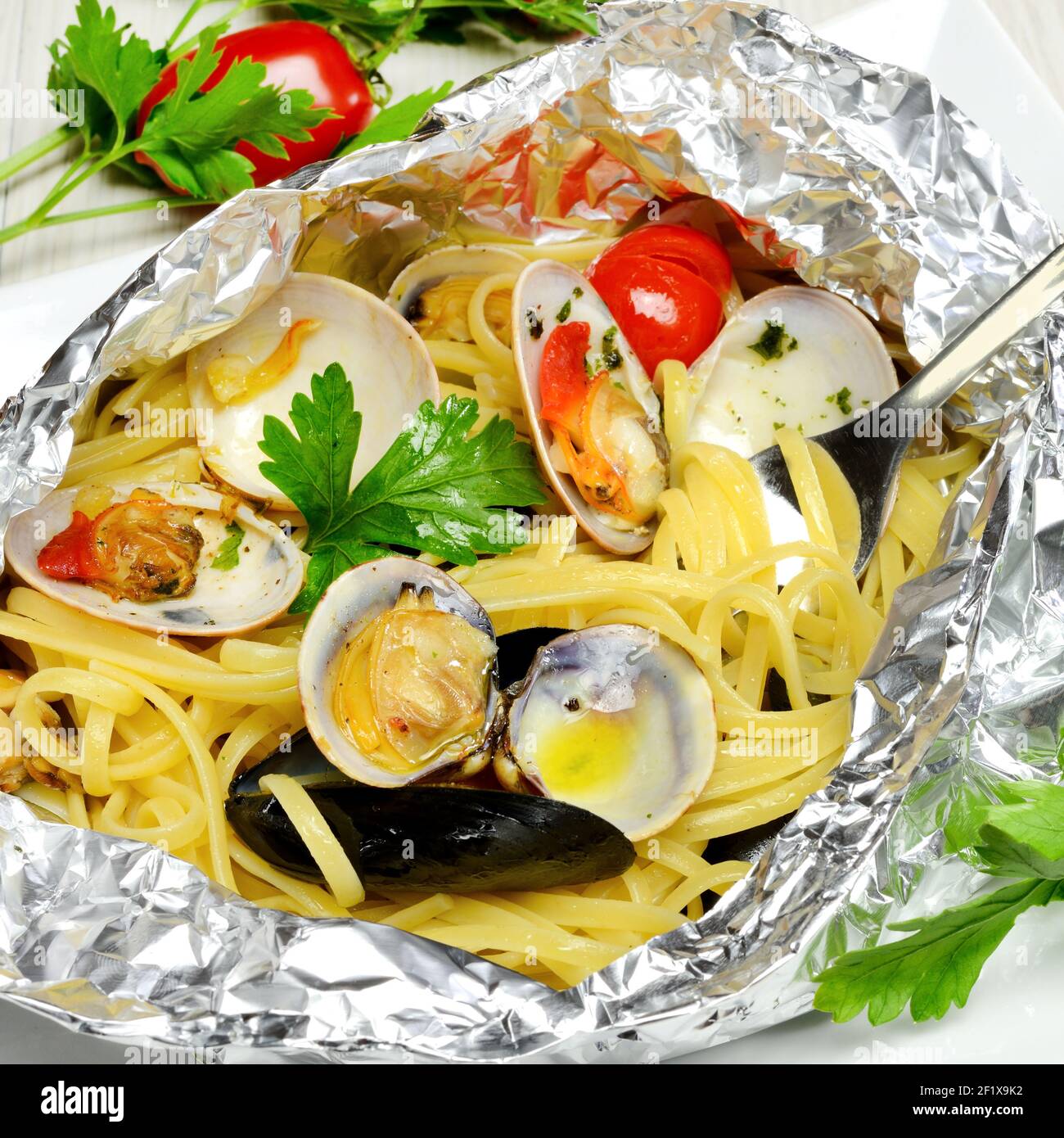 Spaghetti al cartoccio, italian traditional recipe seafood cooked Stock Photo