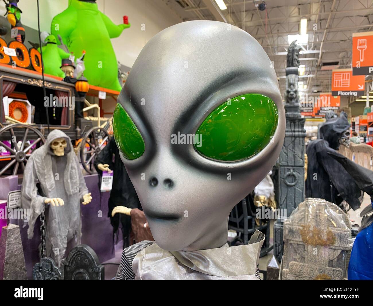 Department store aisle with Halloween decorations and products Stock