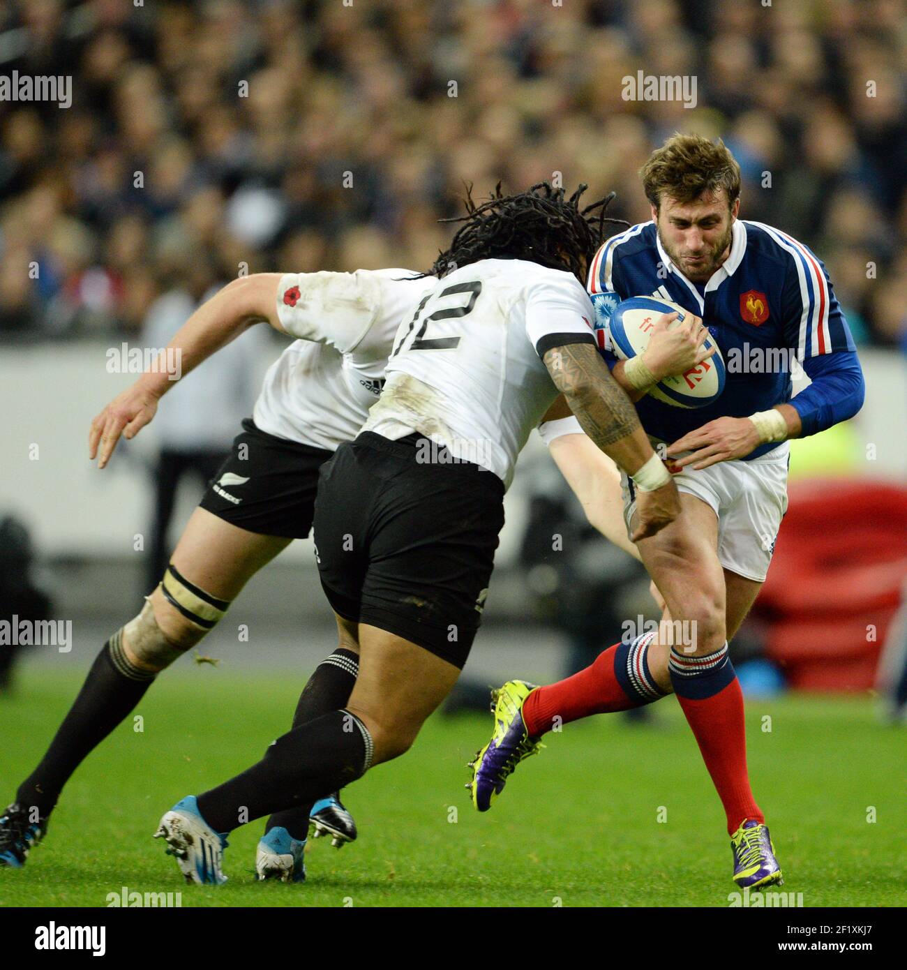 France's Maxime Medard challenges by Ma'a Nonu of New Zealand during the rugby union test match 2013 between France and New Zealand on November 9, 2013 in Saint Denis, France. Photo Philippe Millereau / KMSP / DPPI Stock Photo