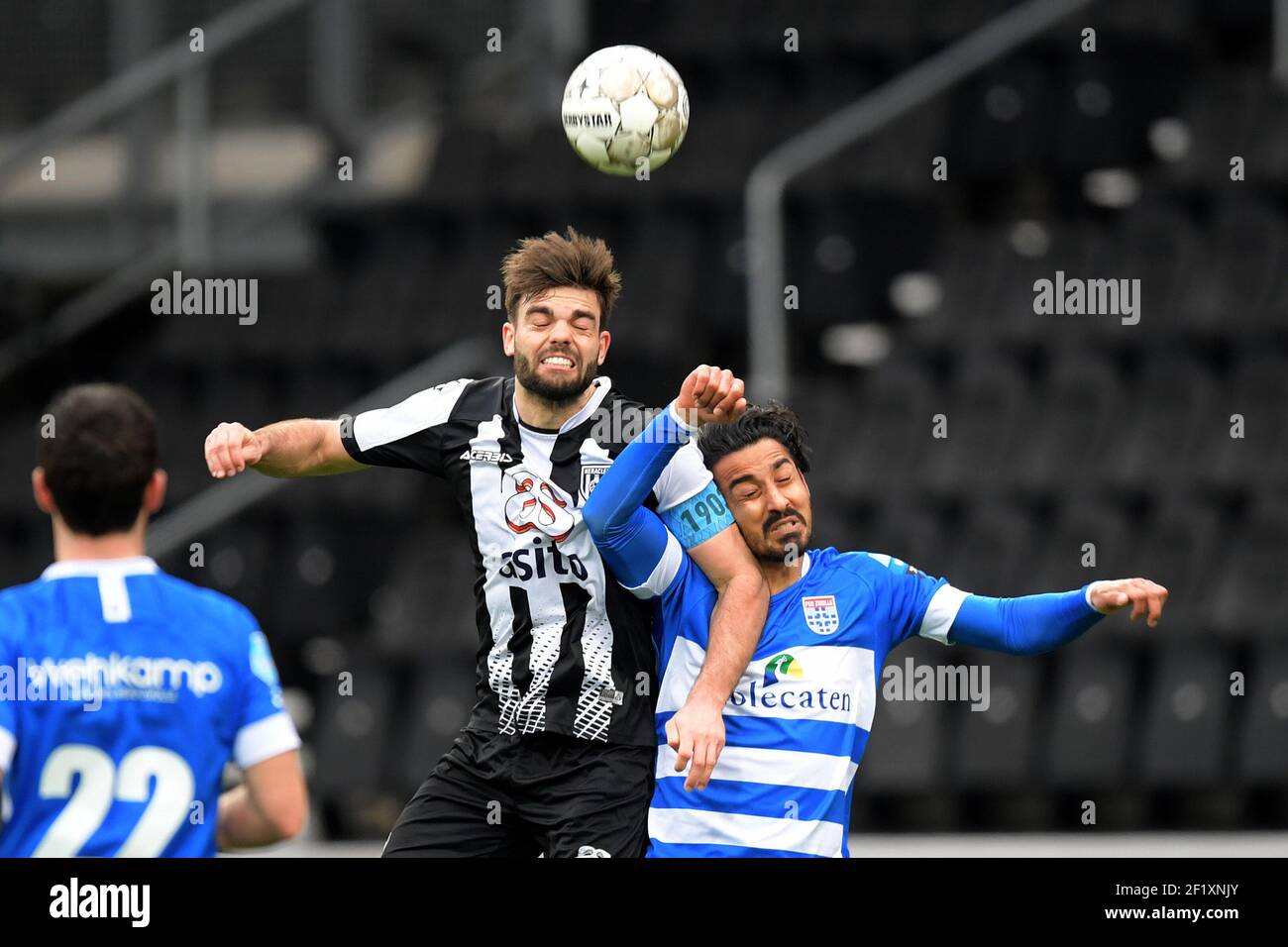 ALMELO, NETHERLANDS - MARCH 7: Robin Propper of Heracles Almelo, Reza Ghoochannejhad of PEC Zwolle during the Dutch Eredivisie match between Heracles Stock Photo