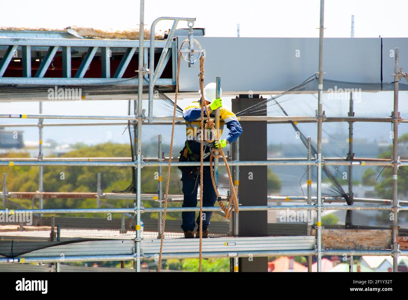 Construction Worker in a Scaffold Stock Photo