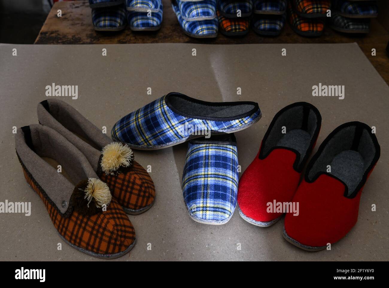 04 March 2021, Berlin: Slippers in the 3 basic forms of the slippers  manufactured here as collar slipper (l-r), slipper and Niedertreter are in  Jünemanns Pantoffeleck in Torstraße. The Jünemann family's Pantoffeleck
