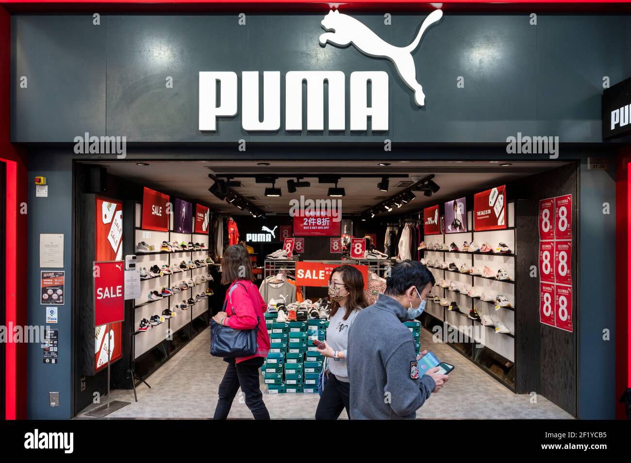 Pedestrians walk past German multinational sportswear Puma store in Hong Kong. (Photo Chukrut Budrul / SOPA Images/Sipa USA Stock Photo - Alamy