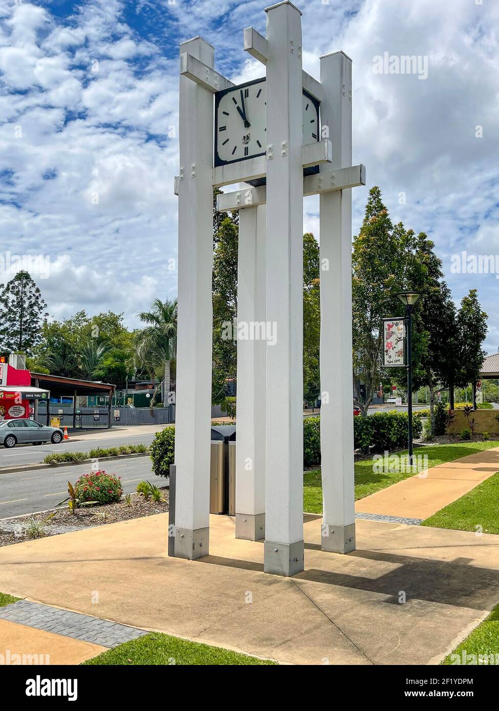 The clock tower located in the park in the central landscaped garden of