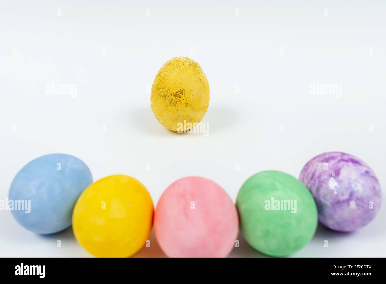 Easter egg decorated with glitter. Easter eggs on a white background. Blurred colorful Easter eggs Stock Photo