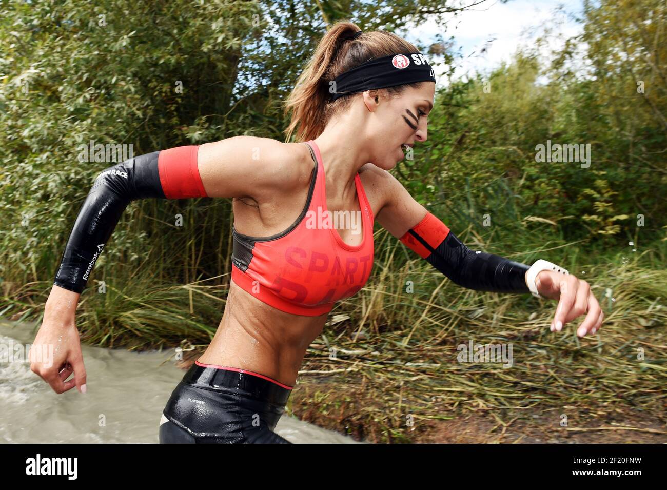 The Miss France 2011 Laury Thilleman competes during the Reebok Spartan  Race in Jablines, on September 19, 2015. The Spartan Race is a race in the  mud with multiple obstacles. Photo Philippe