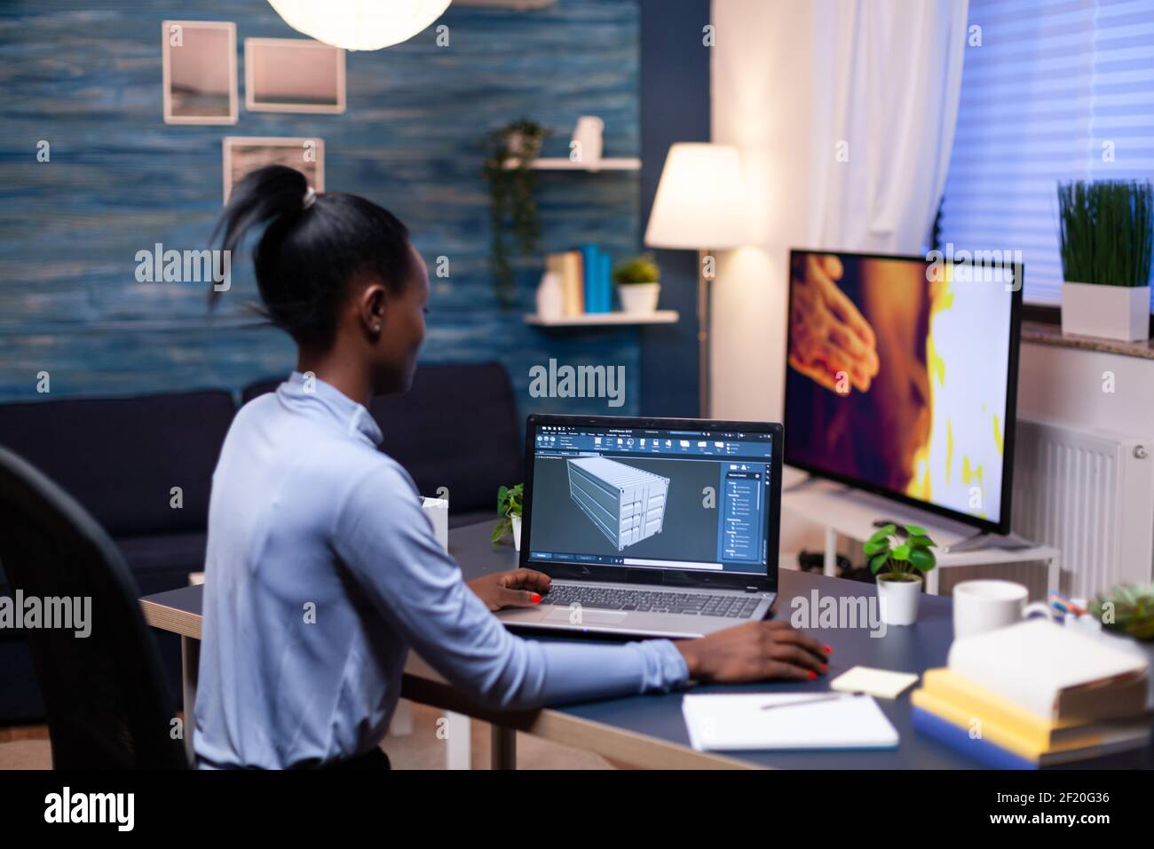 African entrepreneur developer working from home office late at night.  Industrial black female engineer studying prototype idea on personal  computer showing software on device display Stock Photo - Alamy