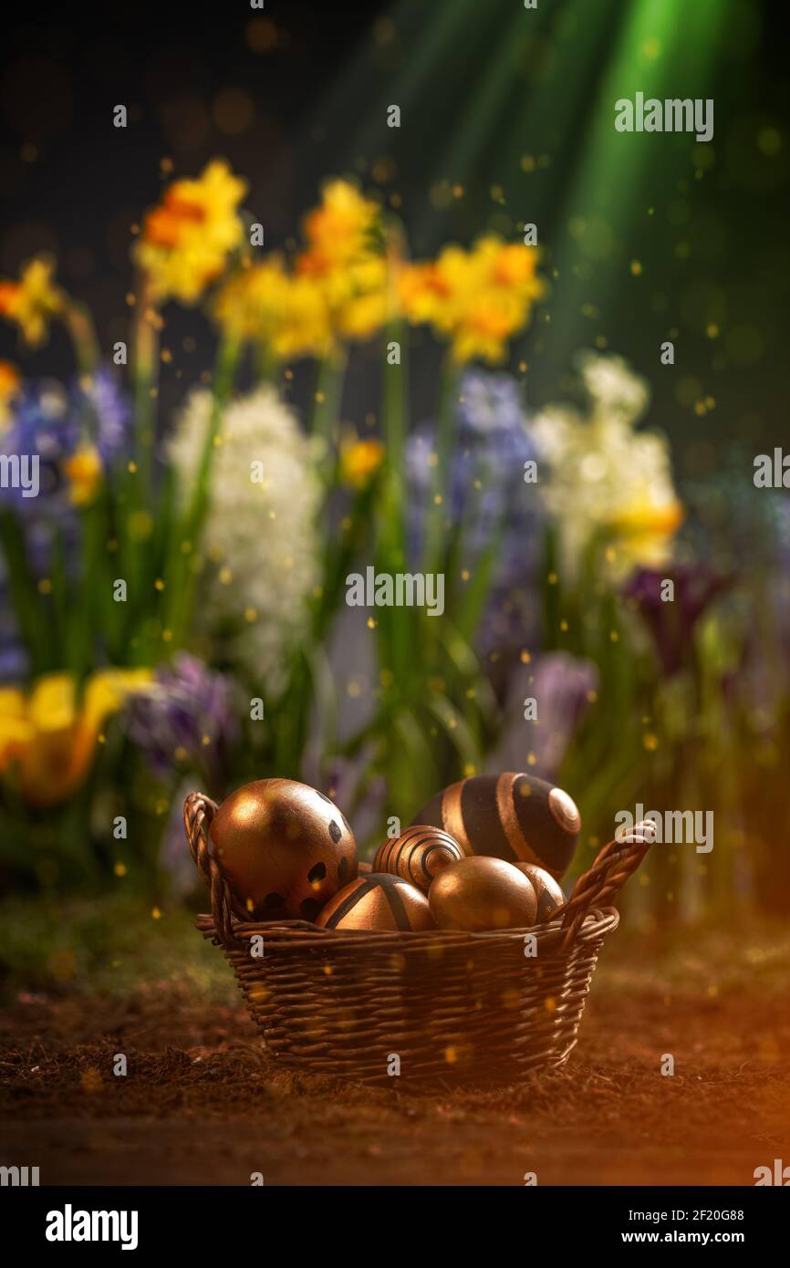Easter eggs in wicker basket Stock Photo
