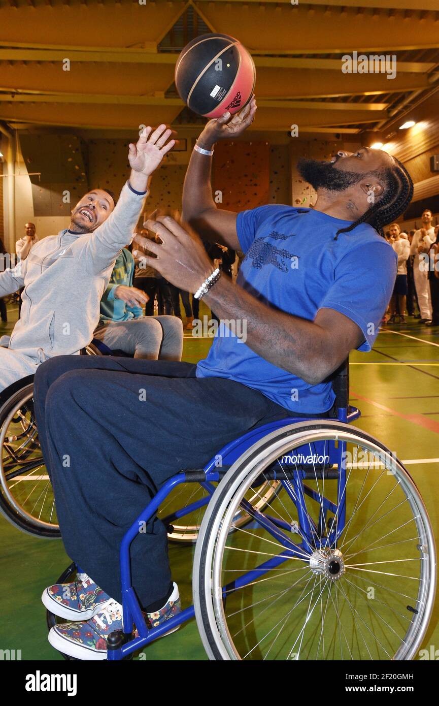 The basketball player Ronny Turiaf and the tennisman Michael Llodra trie the wheelchair basketball during the Etoiles du Sport 2015 in La Plagne, France, on December 13 to 17, 2015 - Photo Philippe Millereau / KMSP / DPPI Stock Photo