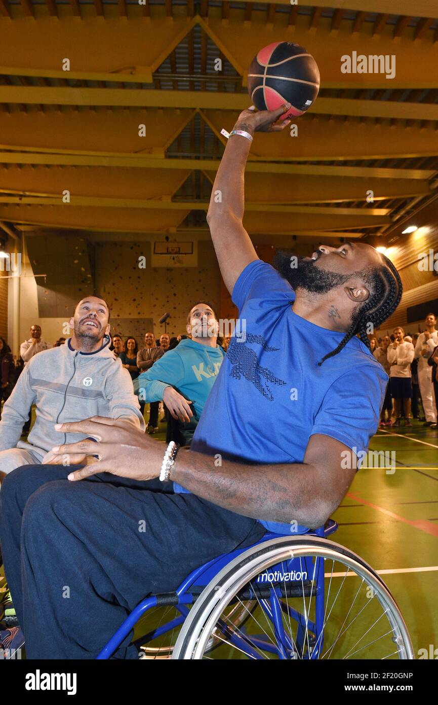 The basketball player Ronny Turiaf and the tennisman Michael Llodra trie the wheelchair basketball during the Etoiles du Sport 2015 in La Plagne, France, on December 13 to 17, 2015 - Photo Philippe Millereau / KMSP / DPPI Stock Photo