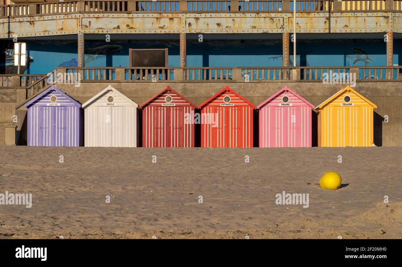 Vibrant beach huts on an empty beach in France Stock Photo
