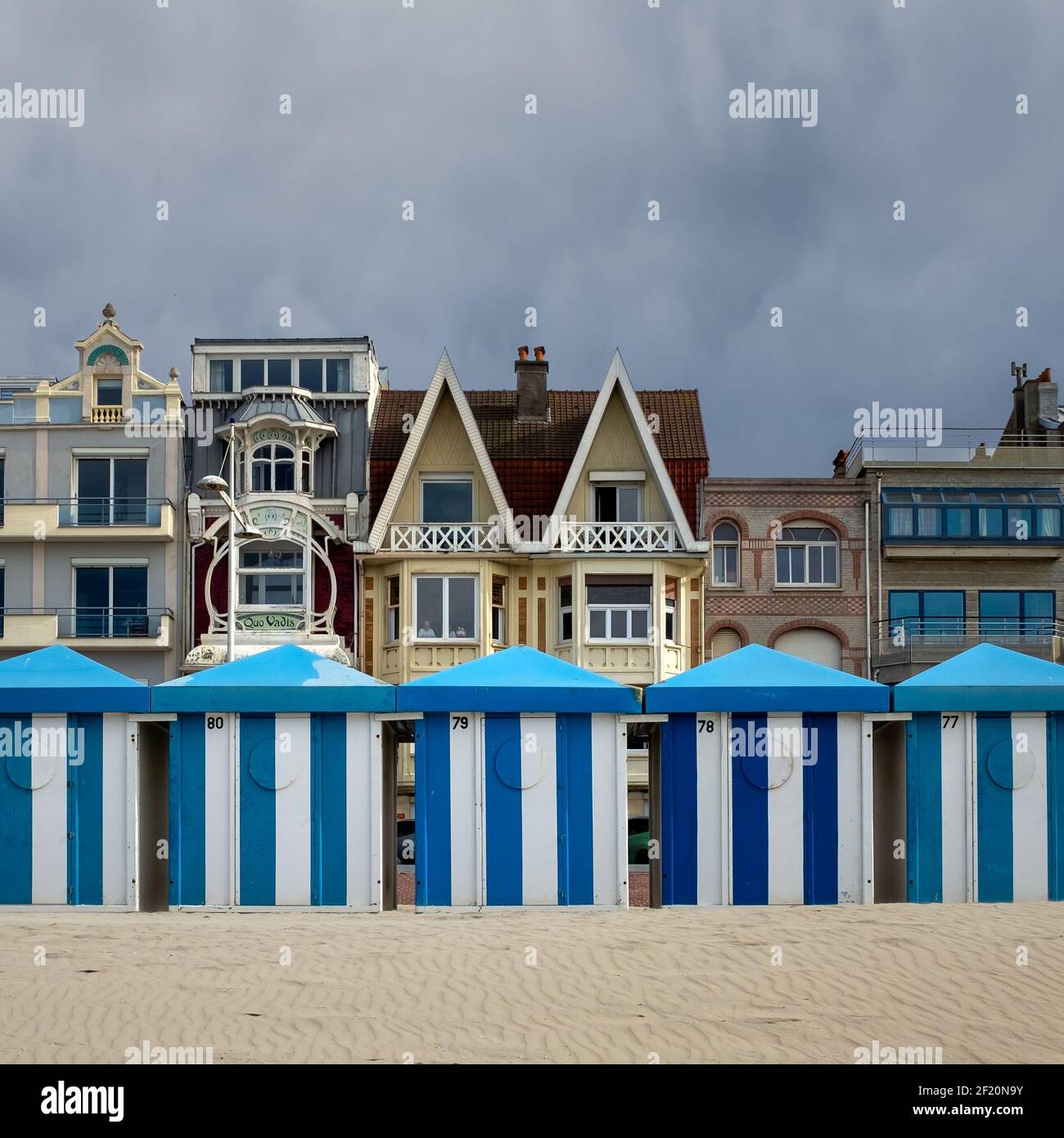 Colorful beach huts in front of historic seaside buildings in Dunkirk, France Stock Photo