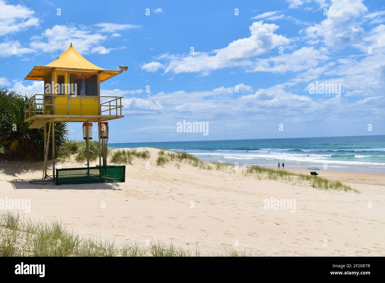 Yellow Lifeguard Surveillance Tower at the Beach Stock Photo
