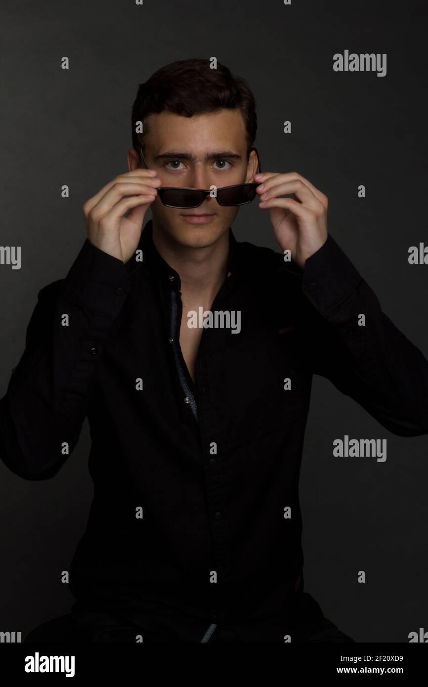 Boy Wearing Sunglasses Behind A Dark Background, Cool Profile