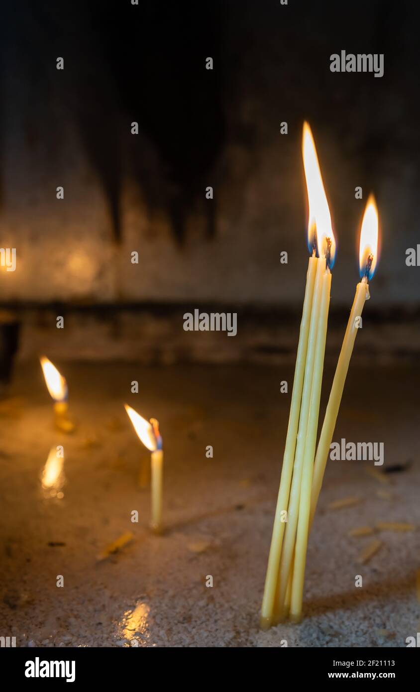 Row of burning memorial candles Stock Photo