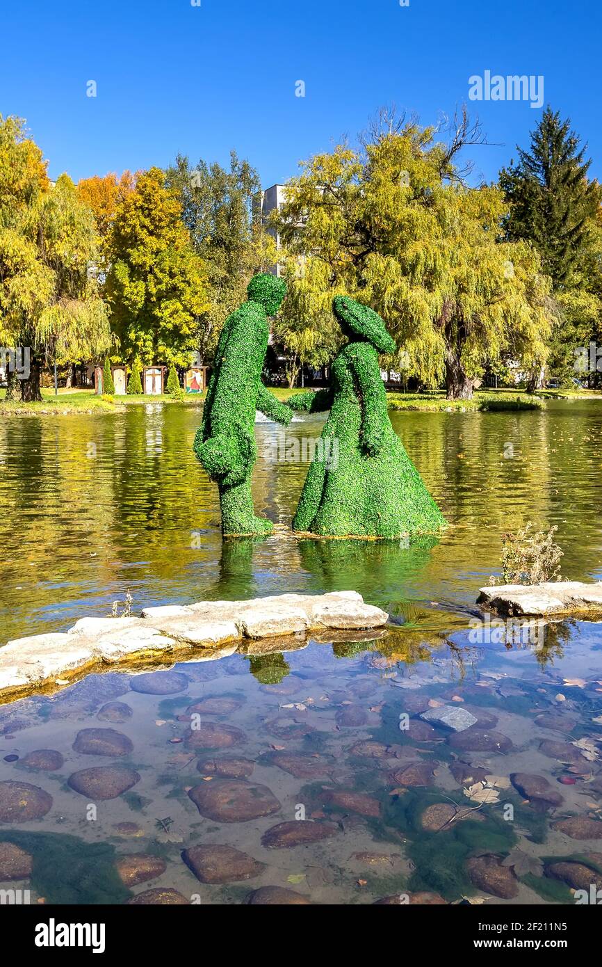 Razlog, Bulgaria lake, man and woman figurines Stock Photo