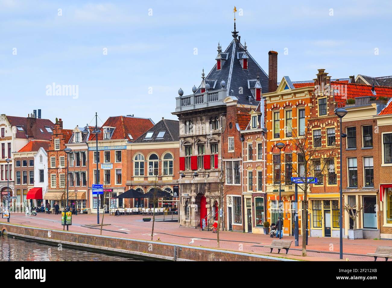 Picturesque landscape with beautiful traditional houses reflection in canal, Haarlem, Holland Stock Photo