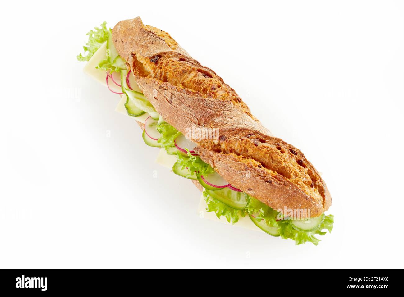 From above of nutritious baguette sandwich with vegetables and cheese slices served on white background Stock Photo