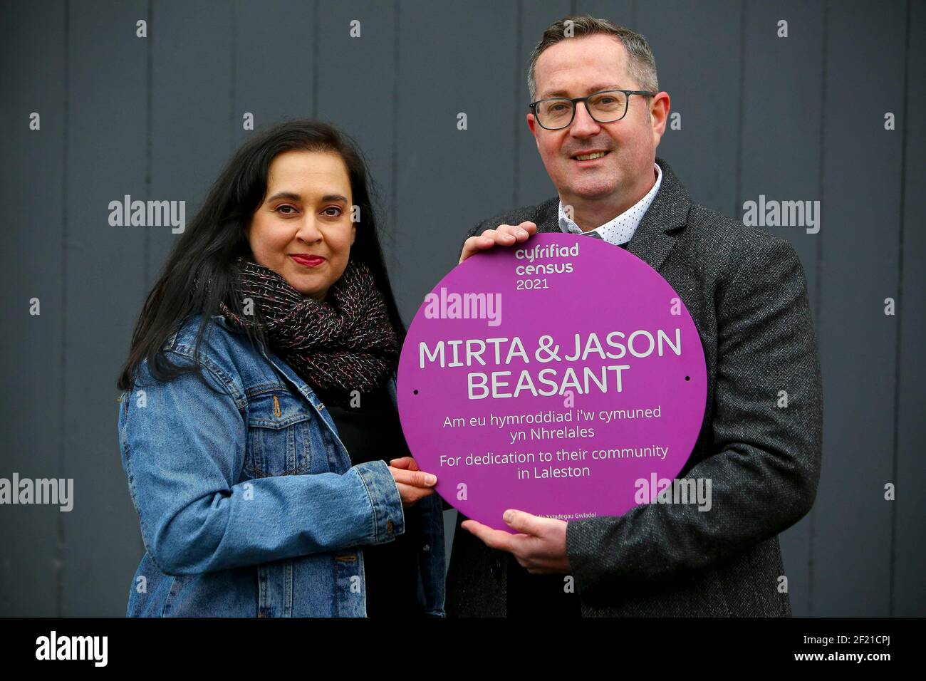 EDITORIAL USE ONLY Mirta and Jason Beasant receive a Census Community Hero purple plaque from the Office for National Statistics for dedication to their community in Laleston, Wales ahead of Census 2021, which is on March 21. Stock Photo