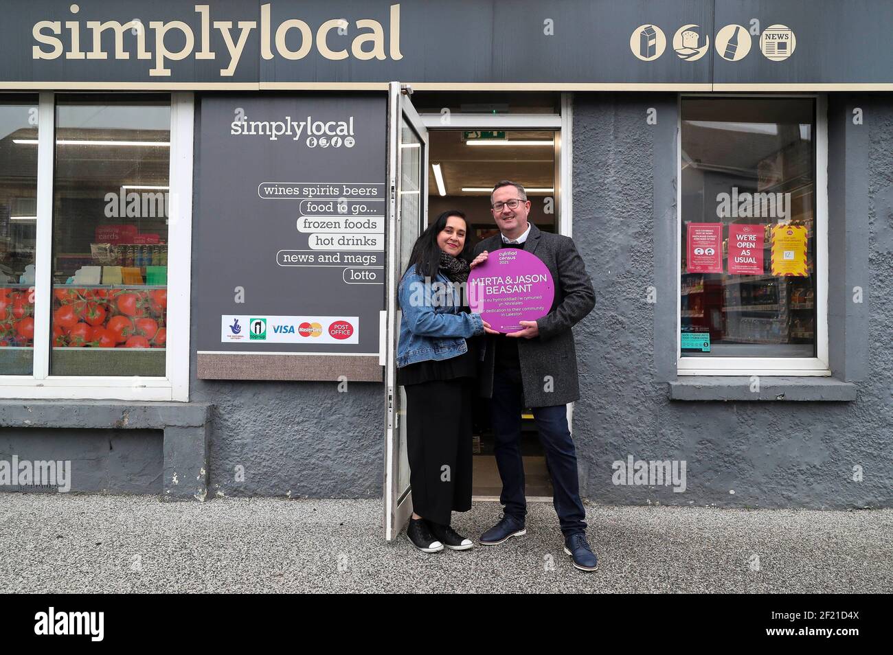 EDITORIAL USE ONLY Mirta and Jason Beasant receive a Census Community Hero purple plaque from the Office for National Statistics for dedication to their community in Laleston, Wales ahead of Census 2021, which is on March 21. Stock Photo