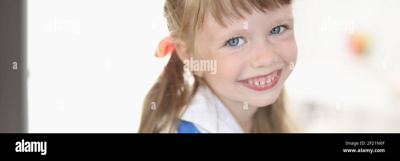 Little girl with blue eyes and blond hair portrait Stock Photo - Alamy