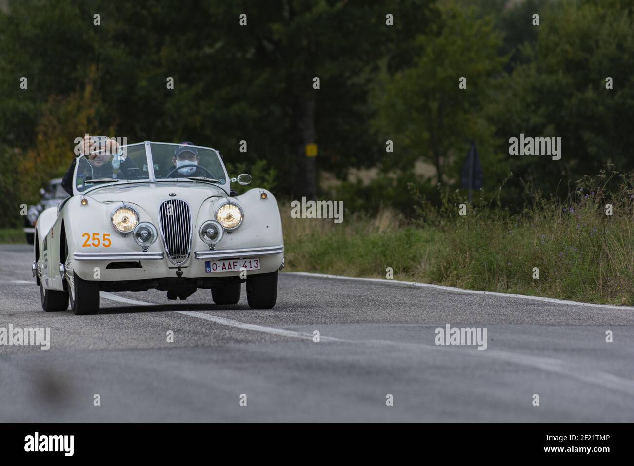 CAGLI, ITALY - Mar 06, 2021: CAGLI , ITALY - OTT 24 - 2020 : JAGUAR XK 120 SE OTS 1954 on an old racing car in rally Mille Miglia 2020 the famous ital Stock Photo