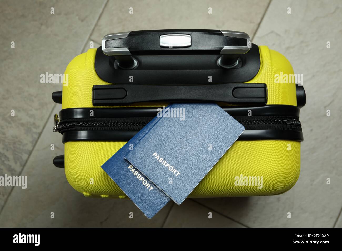Yellow travel bag with passports, top view Stock Photo Alamy