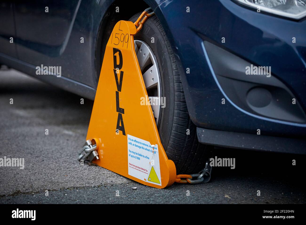 DVLA clamp an un taxed car on the highway in Preston Stock Photo Alamy