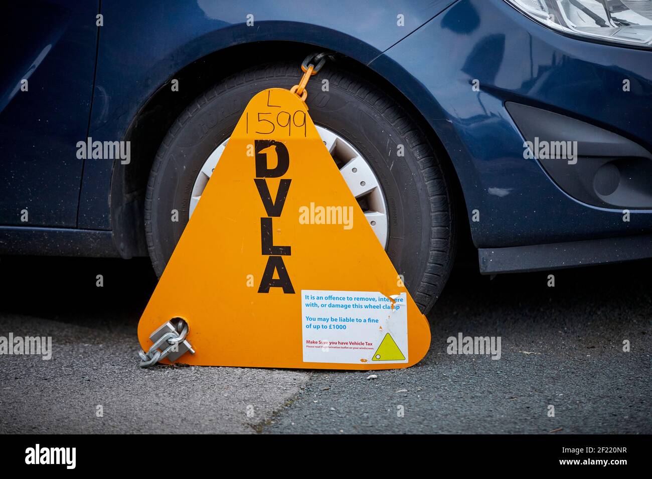 DVLA clamp an un taxed car on the highway in Preston Stock Photo Alamy