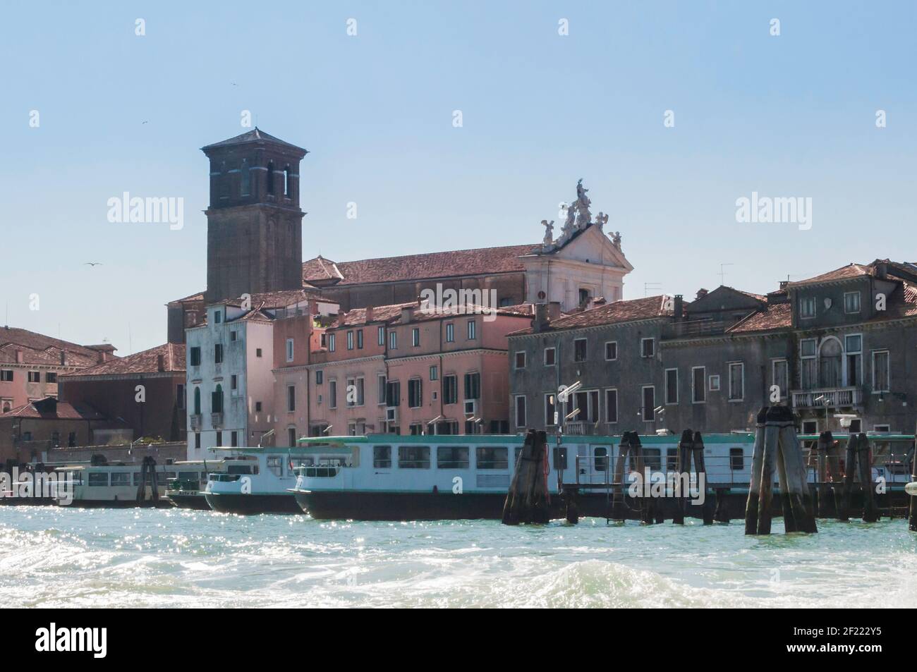 Water taxi ride on a canal in Venice. Old palazzi line the way Stock Photo