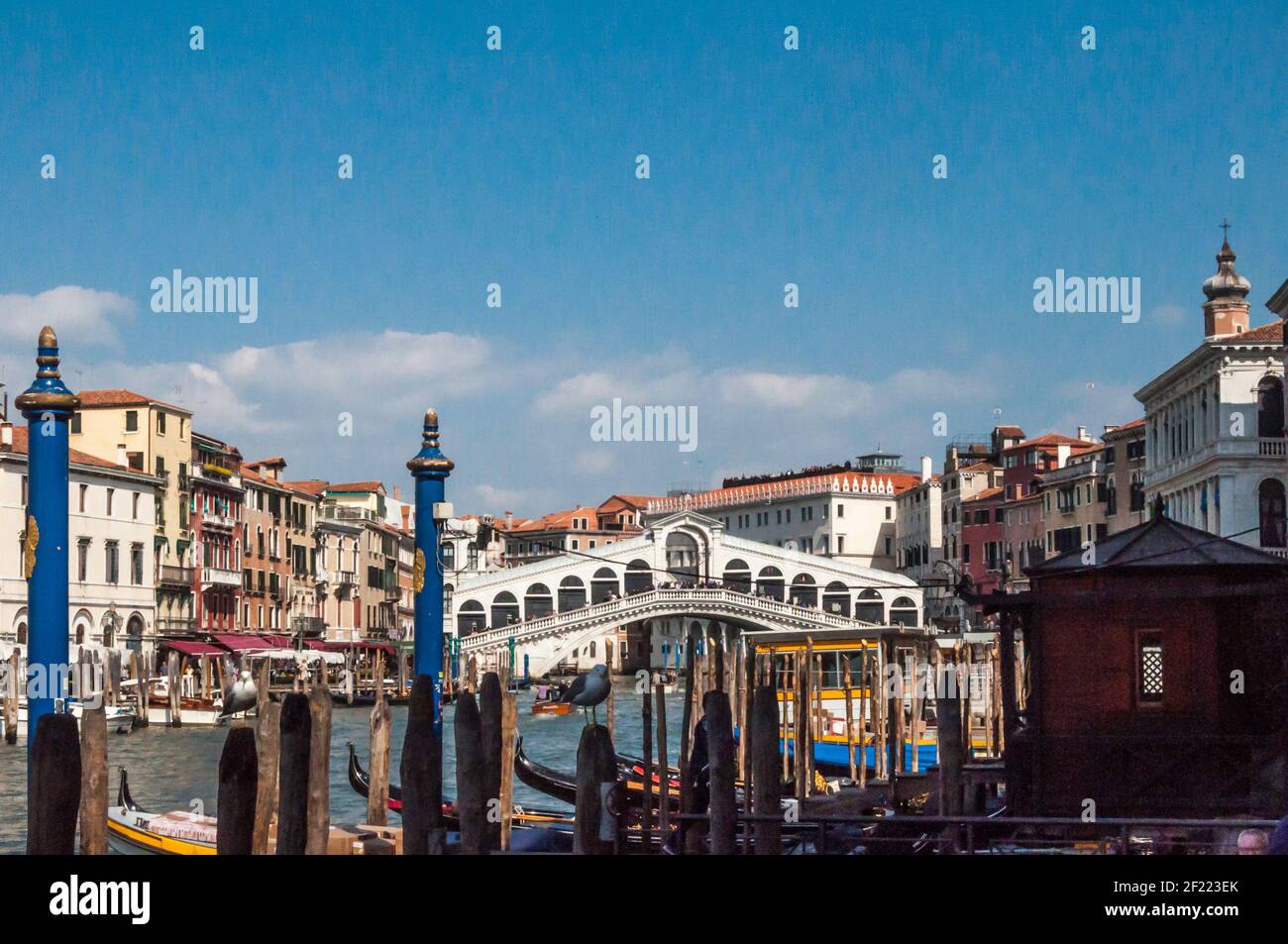Typical scene in Venice. View of a canal lined with old buildings, bridges and gondolas Stock Photo