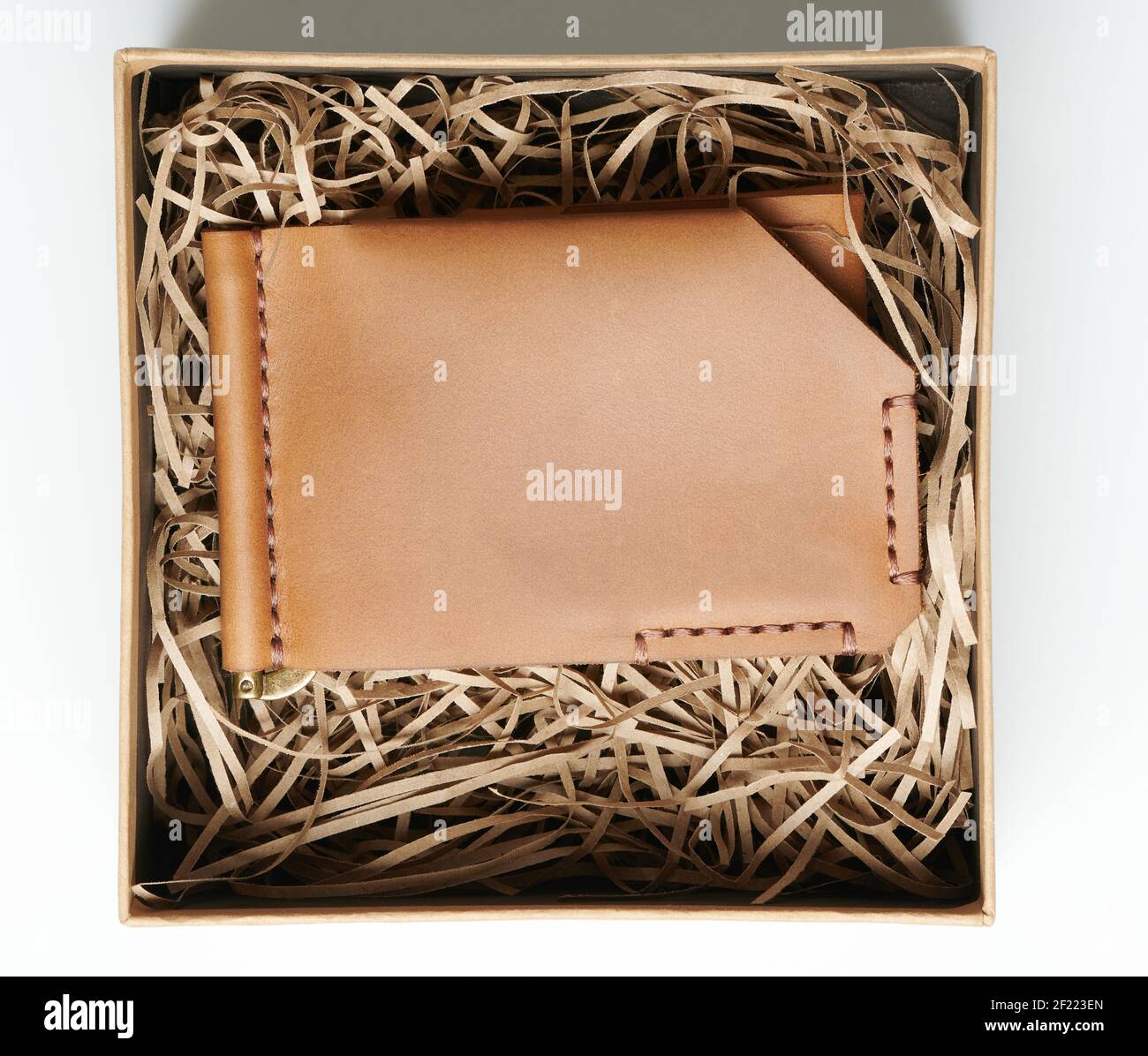 Brown leather wallet in gift box above top view isolated Stock Photo