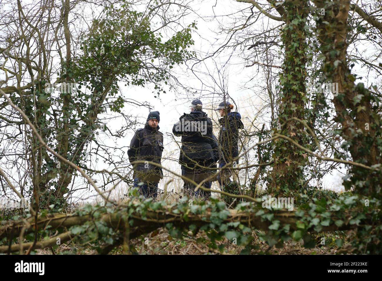 Officers from the Metropolitan Police search woodland near to Great Chart Golf and Leisure in Ashford, Kent. A serving Metropolitan Police officer has been arrested in Deal, Kent, in connection with the disappearance of Sarah Everard who has been missing for a week. The 33-year-old disappeared on Wednesday March 3 after leaving a friend's house in Clapham, south London, and began walking to her home in Brixton. Picture date: Wednesday March 10, 2021. Stock Photo