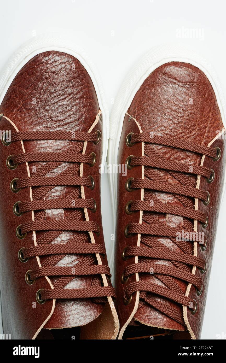 Pair of brown leather keds with laces above top view Stock Photo