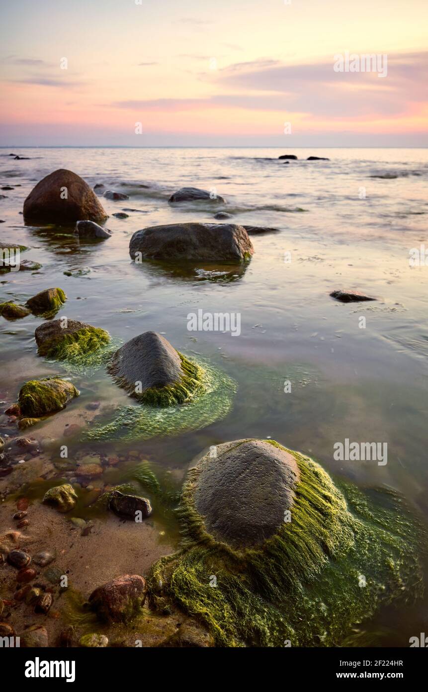 Beautiful rocky sea beach sunset hi-res stock photography and images ...