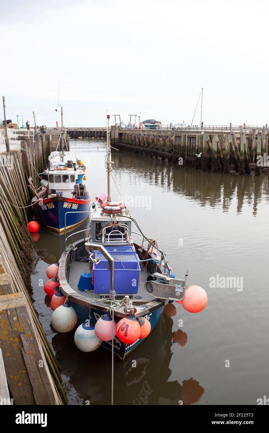 Boats in the harbour at West Bay, Dorset Stock Photo - Alamy