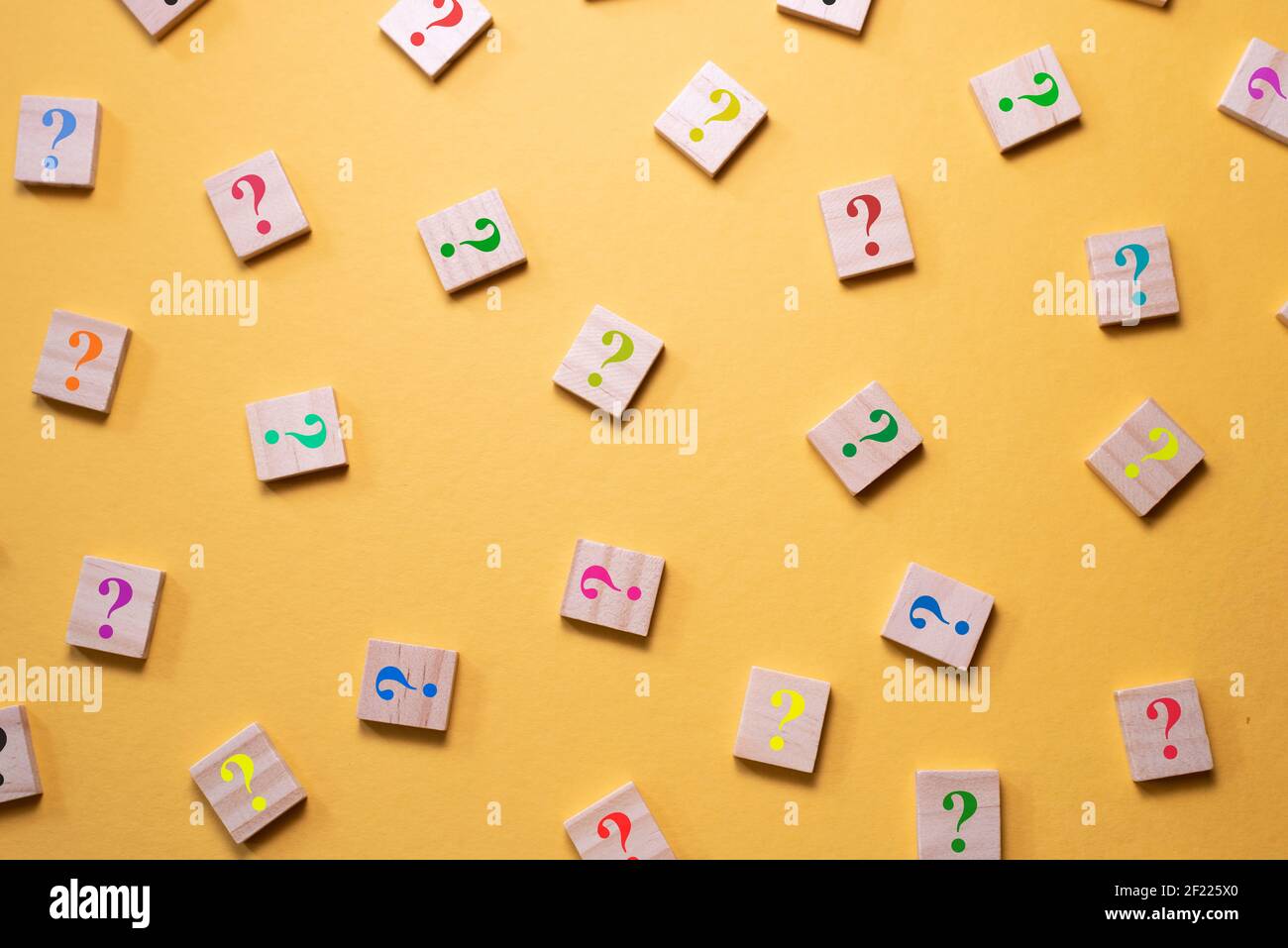 Tile Questions Mark Colorful question mark symbol on wooden tile agains yellow background ...