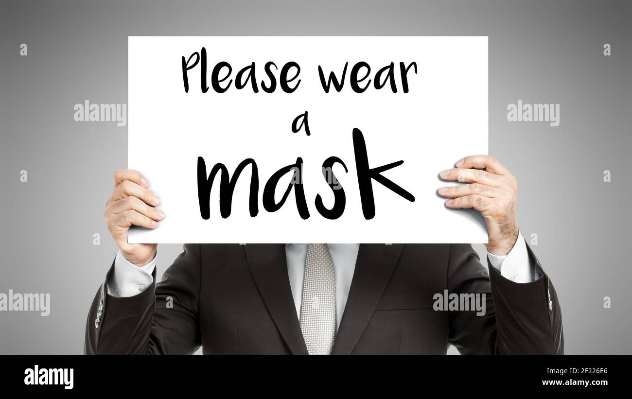 Business man message Please wear a mask Stock Photo