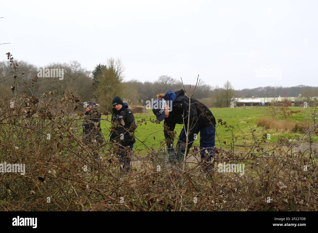 Officers from the Metropolitan Police search land near to Great Chart in Ashford, Kent. A serving Metropolitan Police officer has been arrested in Deal, Kent, in connection with the disappearance of Sarah Everard who has been missing for a week. The 33-year-old disappeared on Wednesday March 3 after leaving a friend's house in Clapham, south London, and began walking to her home in Brixton. Picture date: Wednesday March 10, 2021. Stock Photo