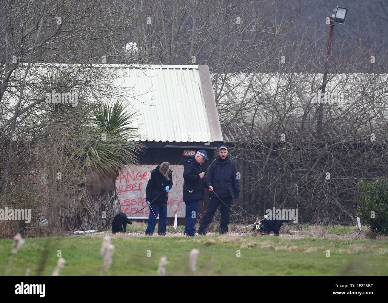 Officers from the Metropolitan Police using police dogs to search land near to Great Chart Golf and Lesiure in Ashford, Kent. A serving Metropolitan Police officer has been arrested in Deal, Kent, in connection with the disappearance of Sarah Everard who has been missing for a week. The 33-year-old disappeared on Wednesday March 3 after leaving a friend's house in Clapham, south London, and began walking to her home in Brixton. Picture date: Wednesday March 10, 2021. Stock Photo