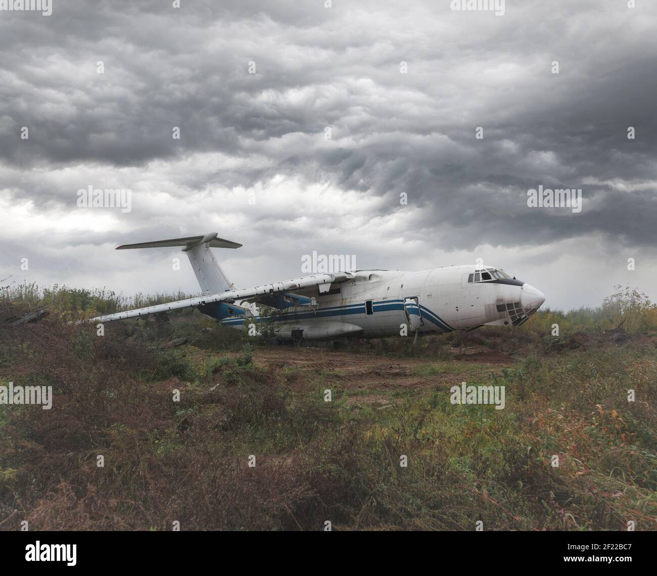 Old Soviet cargo plane IL-76 on the ground in cloudy weather. High quality photo Stock Photo