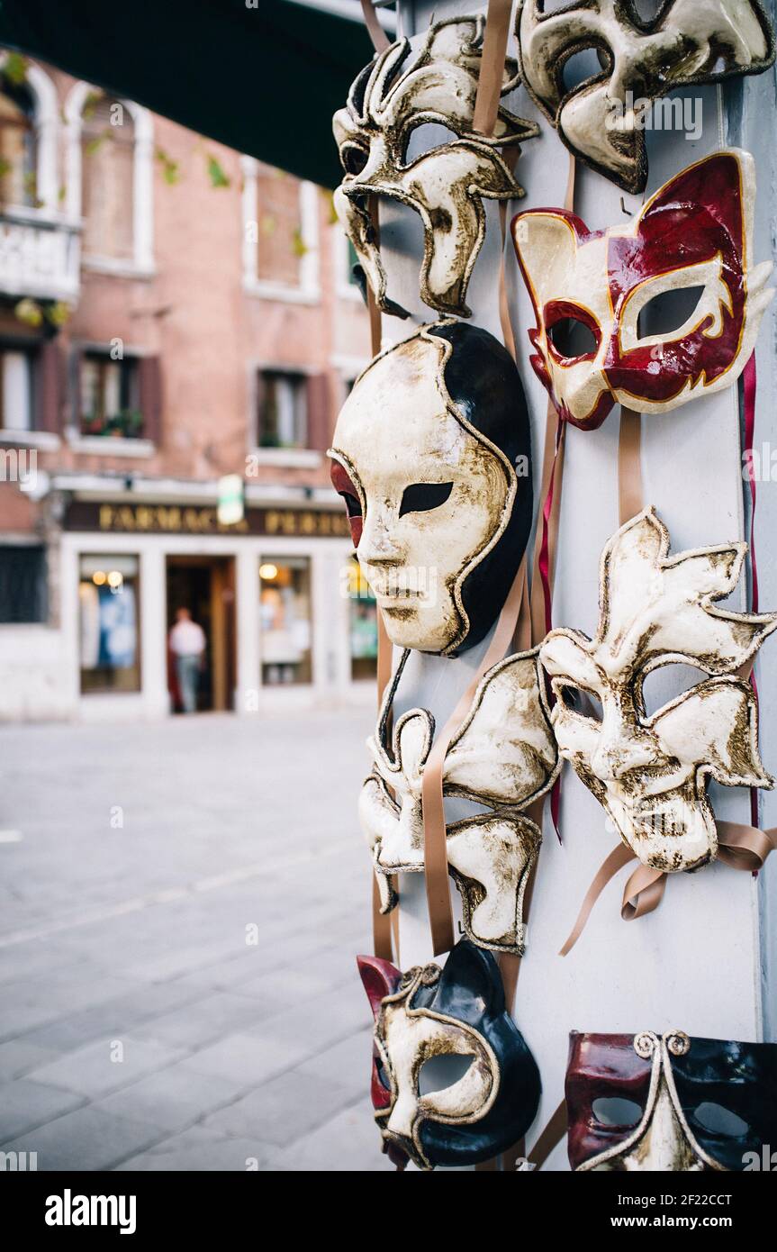Venetian masks on a wall in a street in Venice, Italy Stock Photo - Alamy