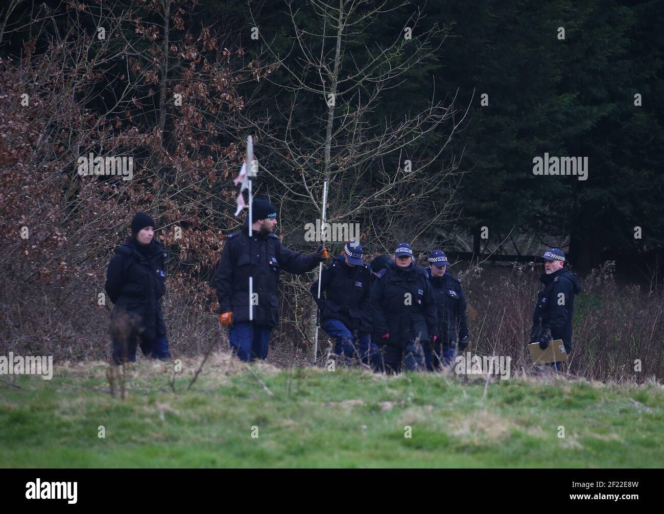 Officers from the Metropolitan Police search woodland near to Great Chart Golf and Lesiure in Ashford, Kent. A serving Metropolitan Police officer has been arrested in Deal, Kent, in connection with the disappearance of Sarah Everard who has been missing for a week. The 33-year-old disappeared on Wednesday March 3 after leaving a friend's house in Clapham, south London, and began walking to her home in Brixton. Picture date: Wednesday March 10, 2021. Stock Photo