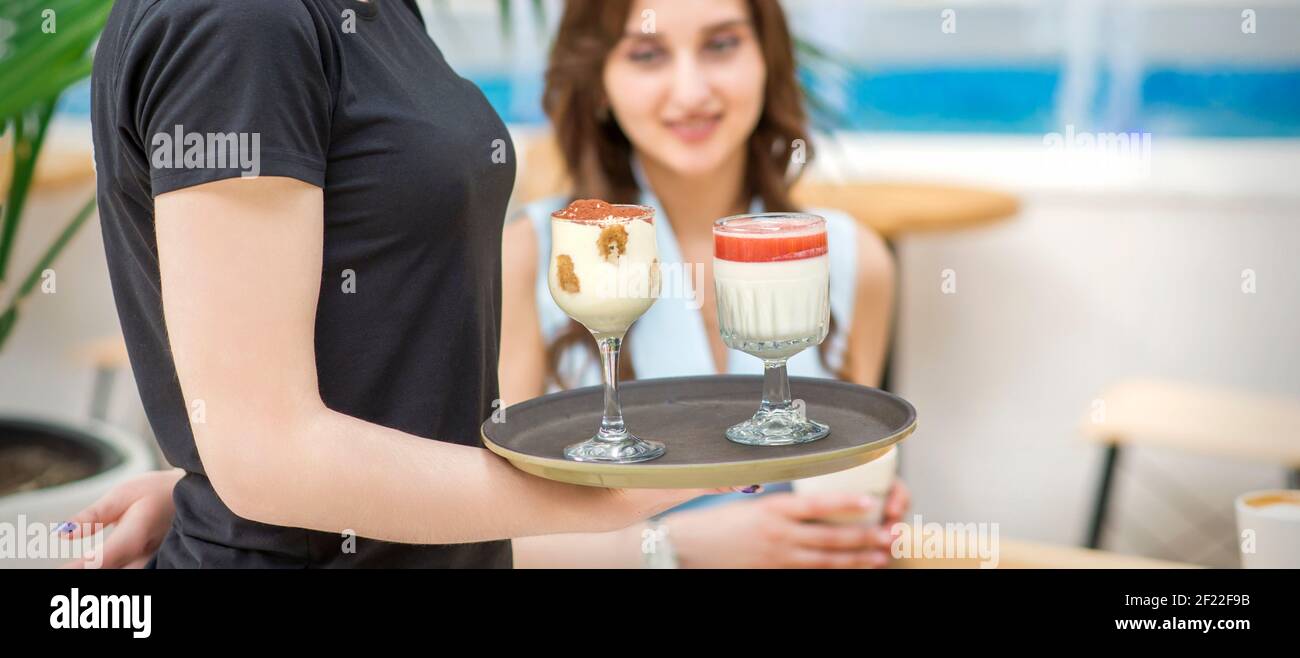 Waiter carrying silver tray hi-res stock photography and images - Alamy