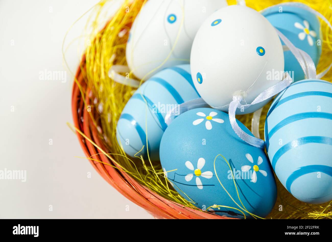 blue white easter eggs in basket isolated Stock Photo - Alamy