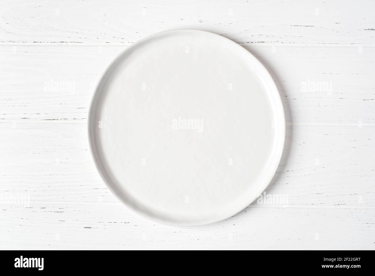 An empty plate on a white table. Stock Photo